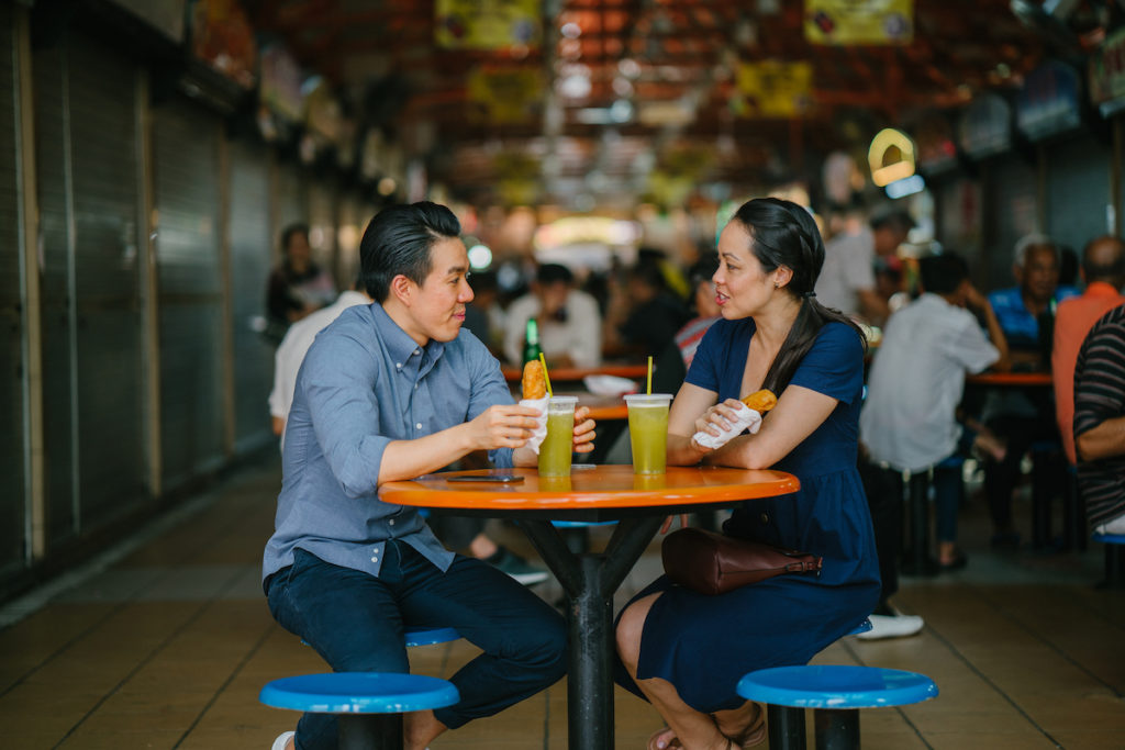 couple eating at a food street
