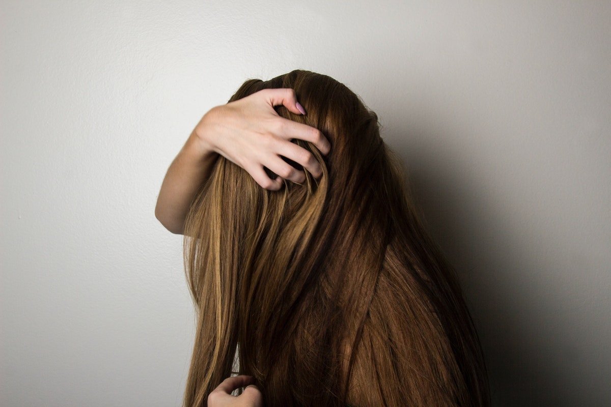 woman holding hair