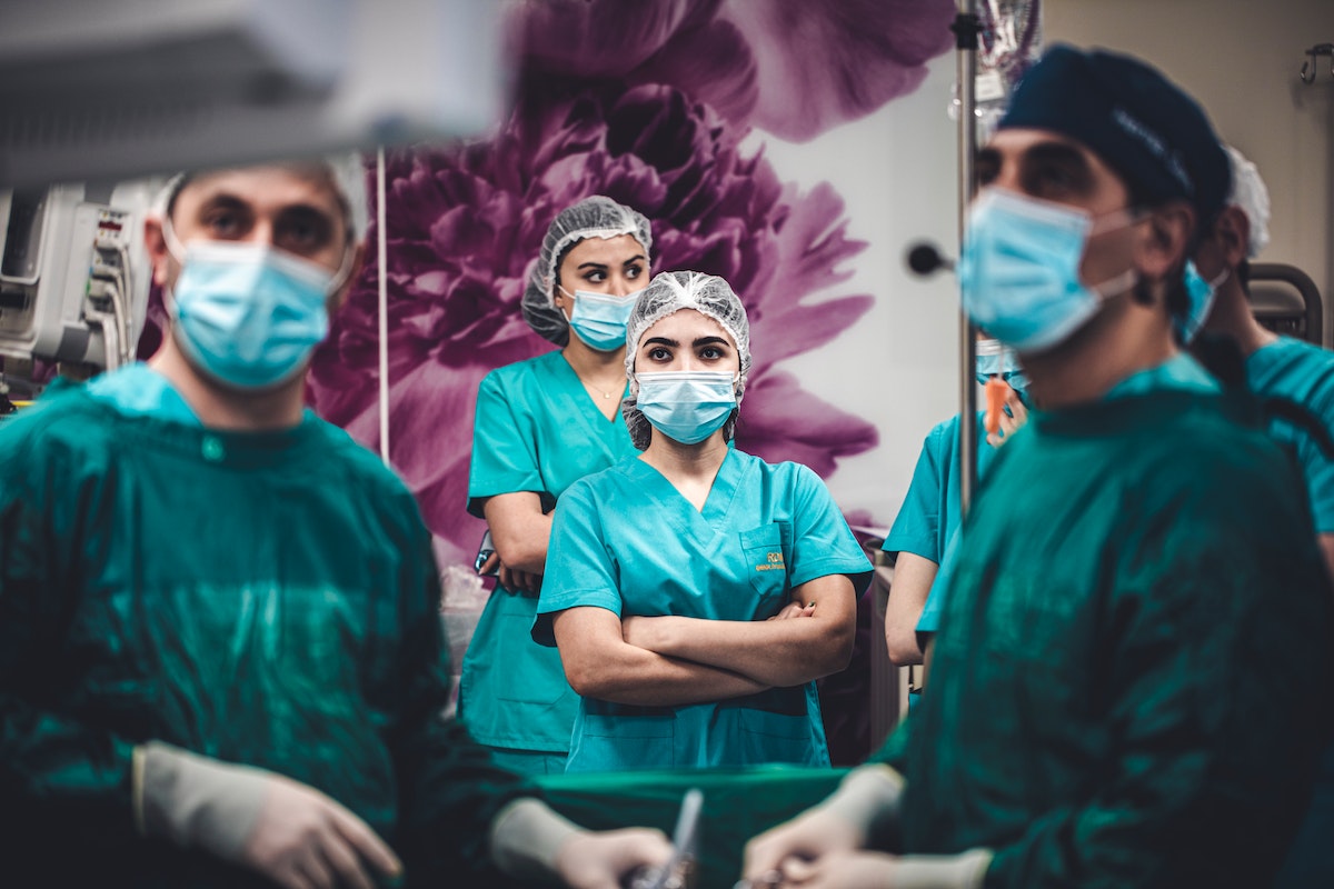 nurses watching an operation