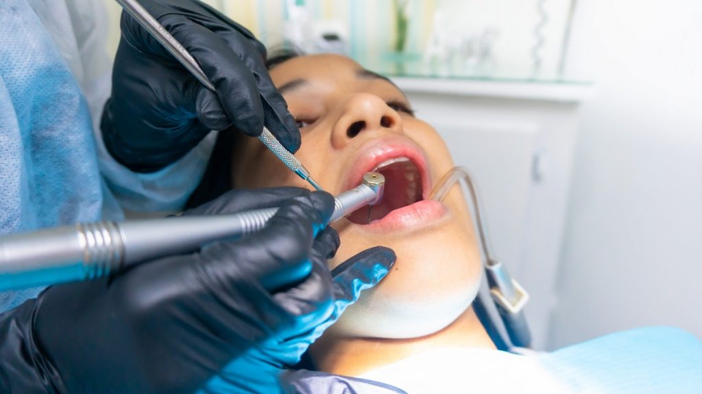person getting tooth procedure