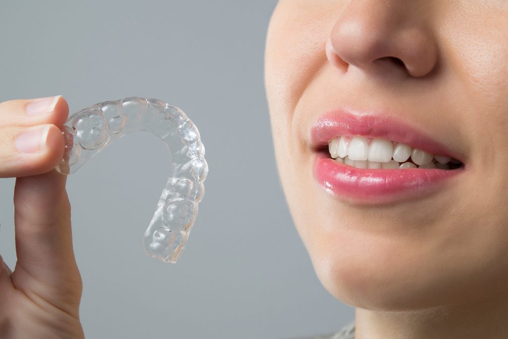 woman considering an Invisalign