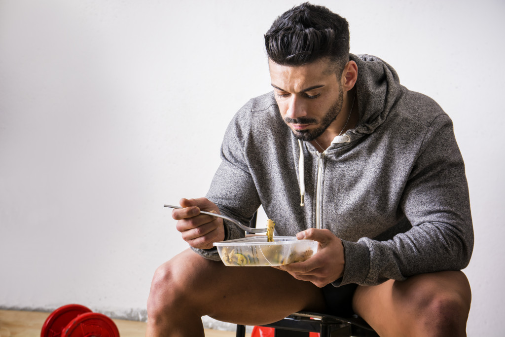 man eating after exercising