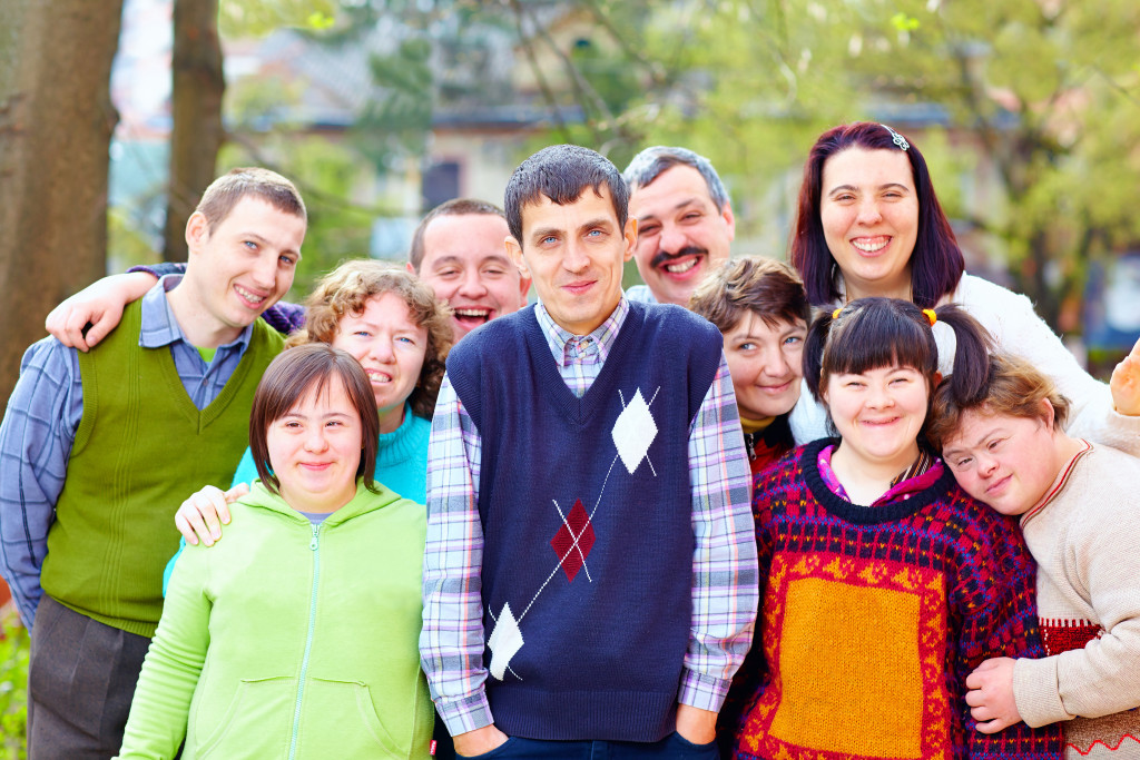 A happy group of people with disabilities close together