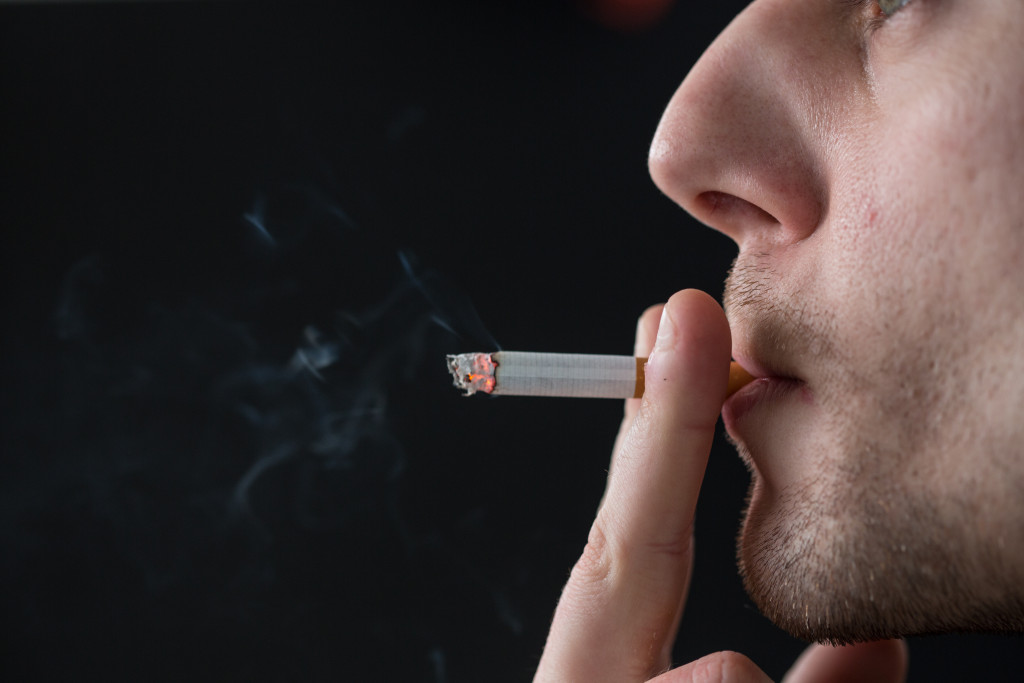 close up image of a man smoking