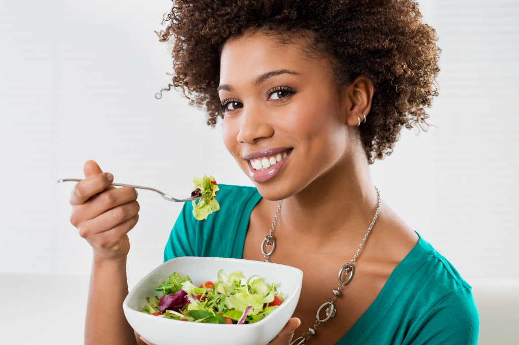 A woman eating her salad