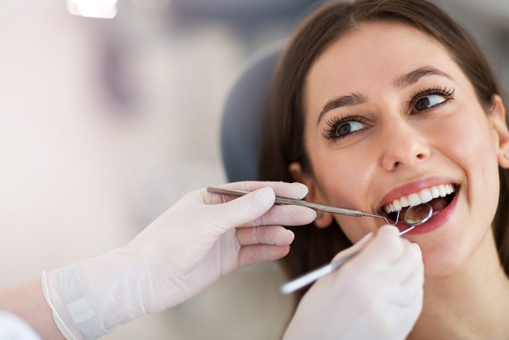 female in dentist for dental check up